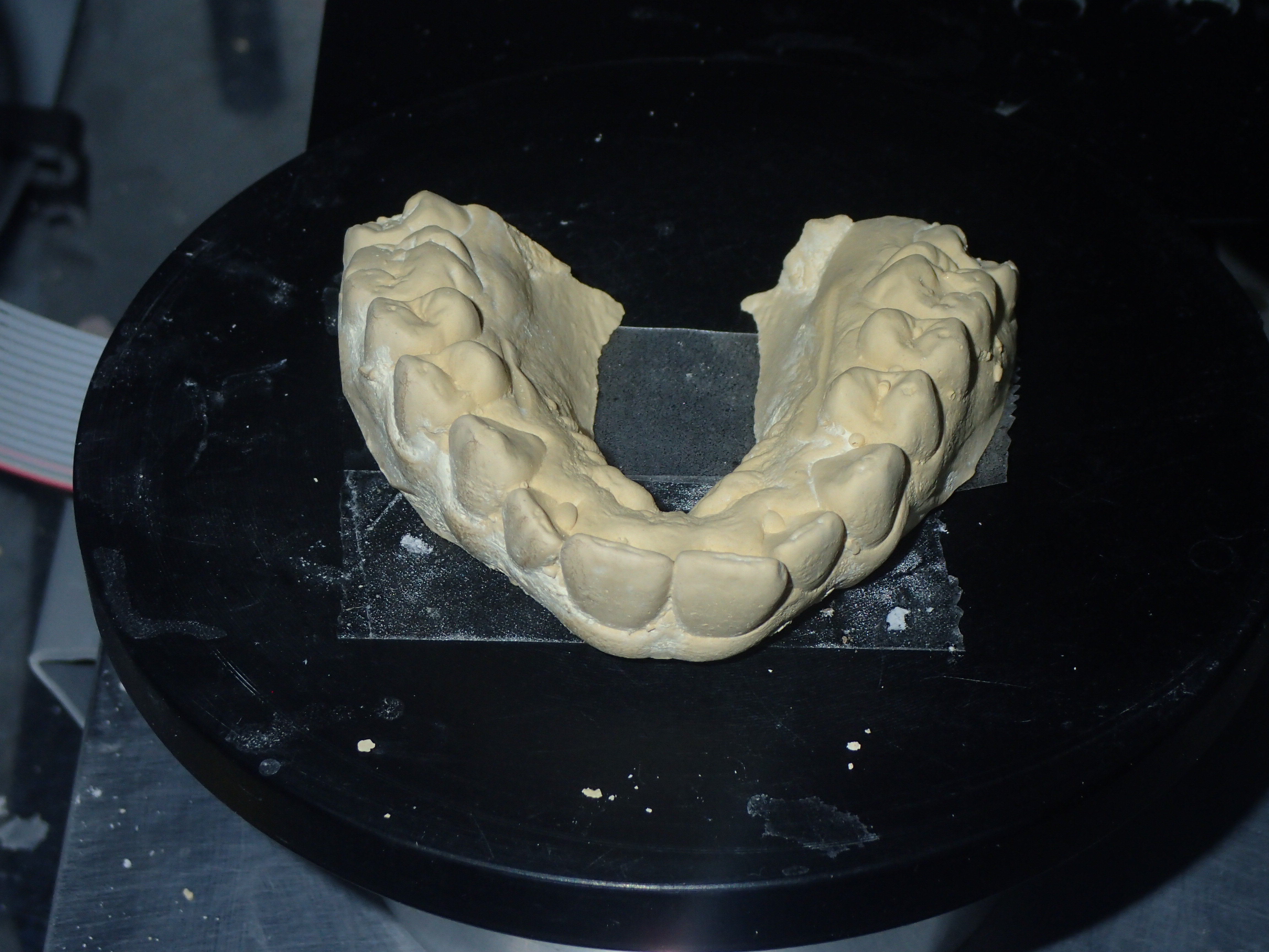 Cast placed in 3D scanner.  Laser will scan X,Y Z axis to generate 3 D model